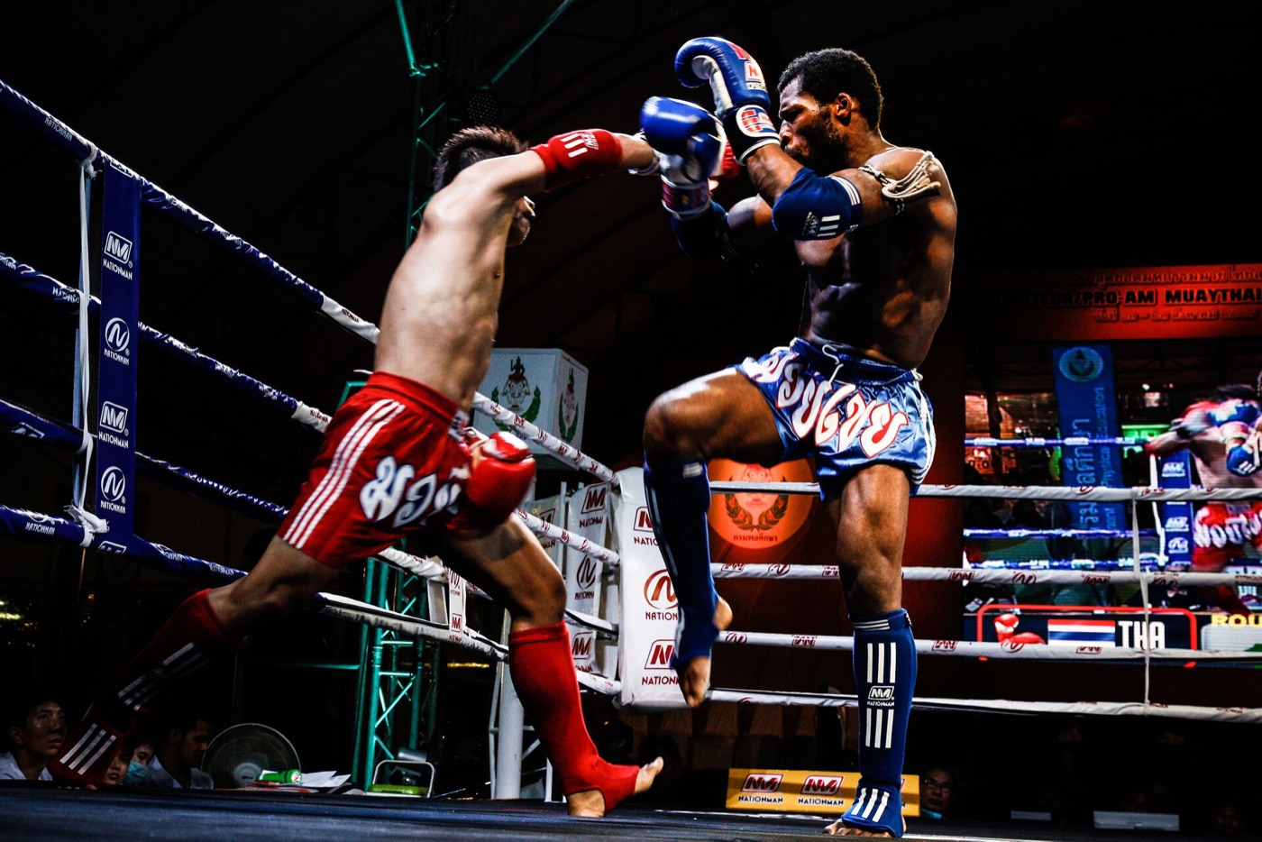 Muay Thai fighters exchanging strikes